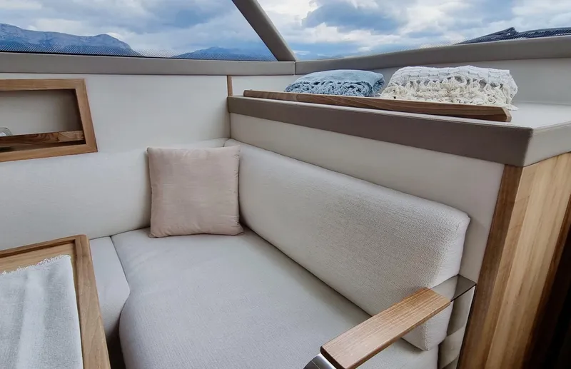 Monachus 470 Fly Yacht Photos Pics Luxurious interior of 2026 Monachus 470 FLY yacht with cozy seating and cushions.