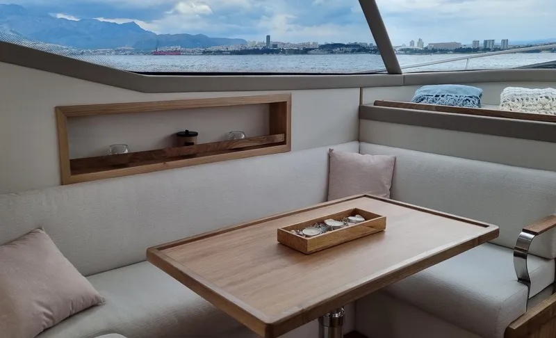 Monachus 470 Fly Yacht Photos Pics Luxurious interior of 2026 Monachus 470 FLY yacht with scenic ocean view.