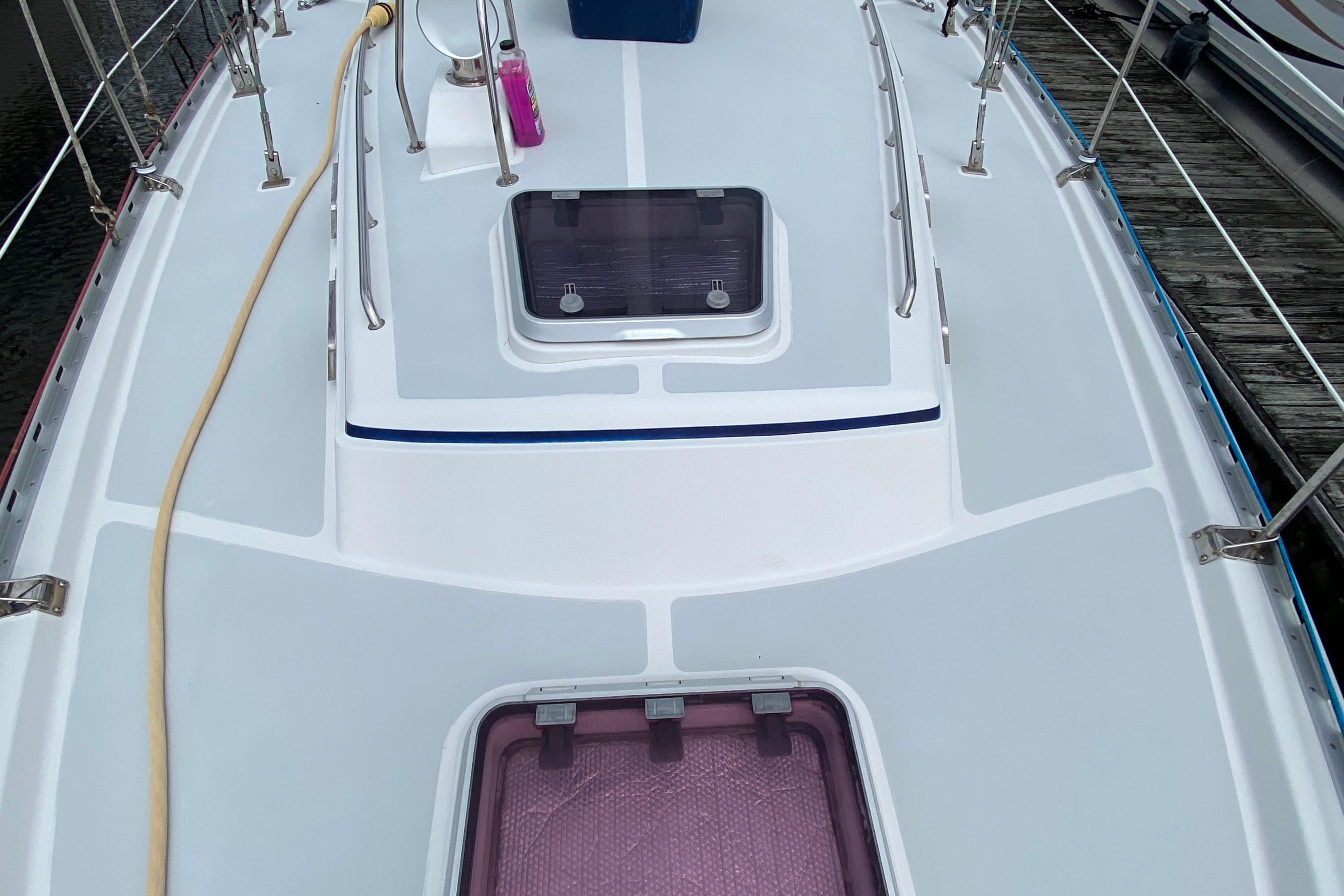 Deck of 2007 Valiant 50 sailboat with hatches and railing.