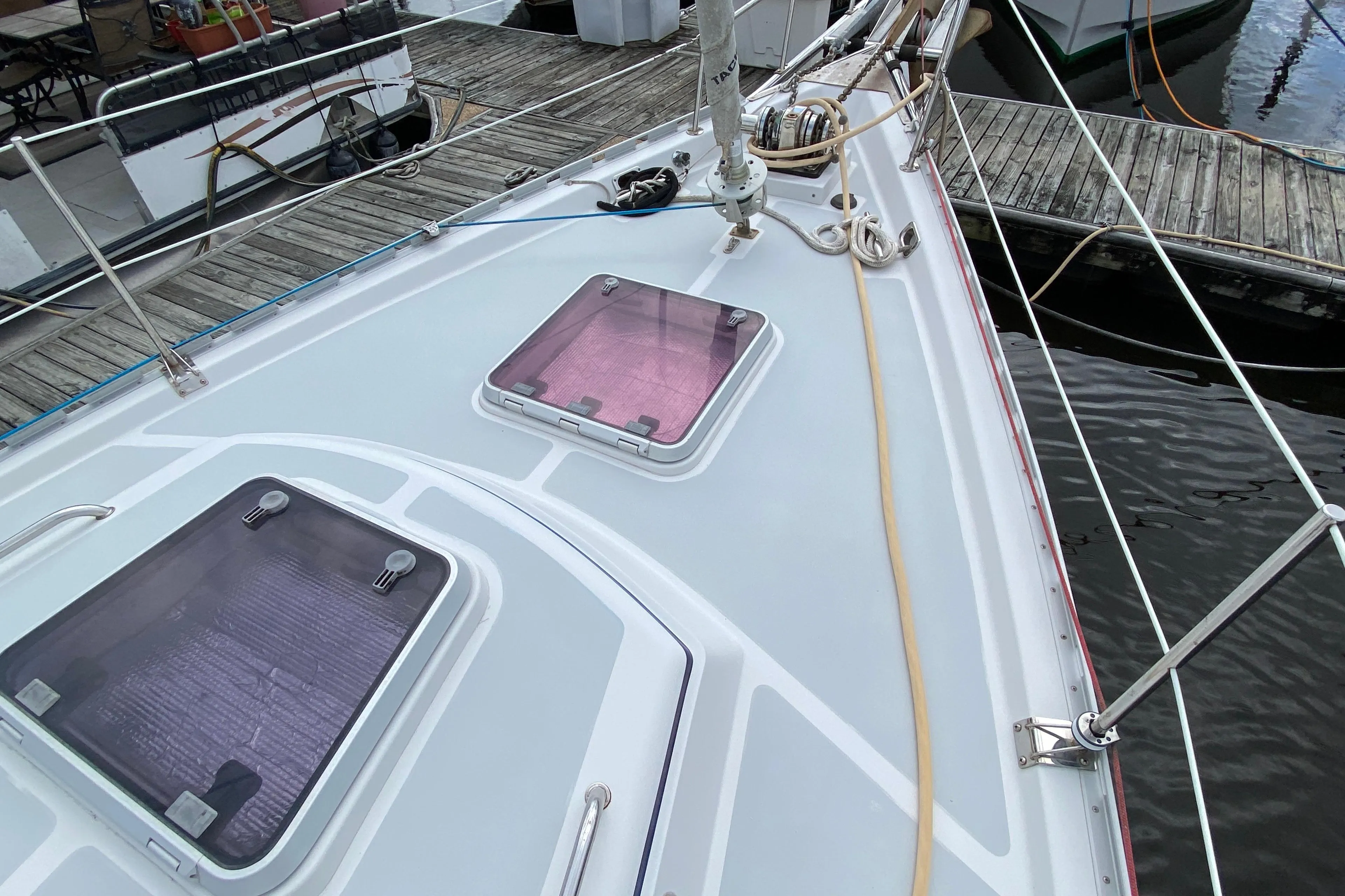 Deck of 2007 Valiant 50 sailboat with hatches, docked at marina.