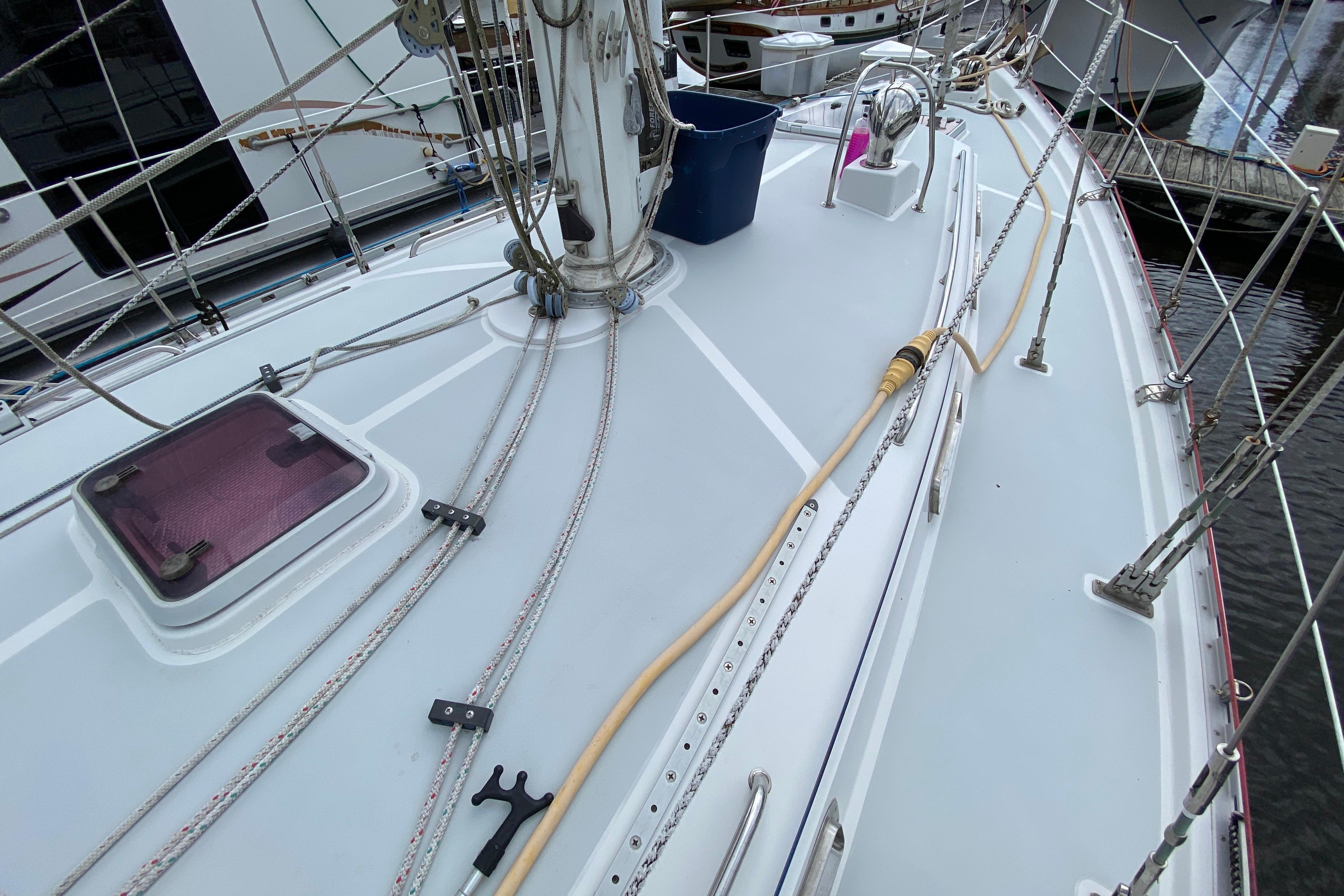 Deck of 2007 Valiant 50 sailboat with ropes and equipment in marina.