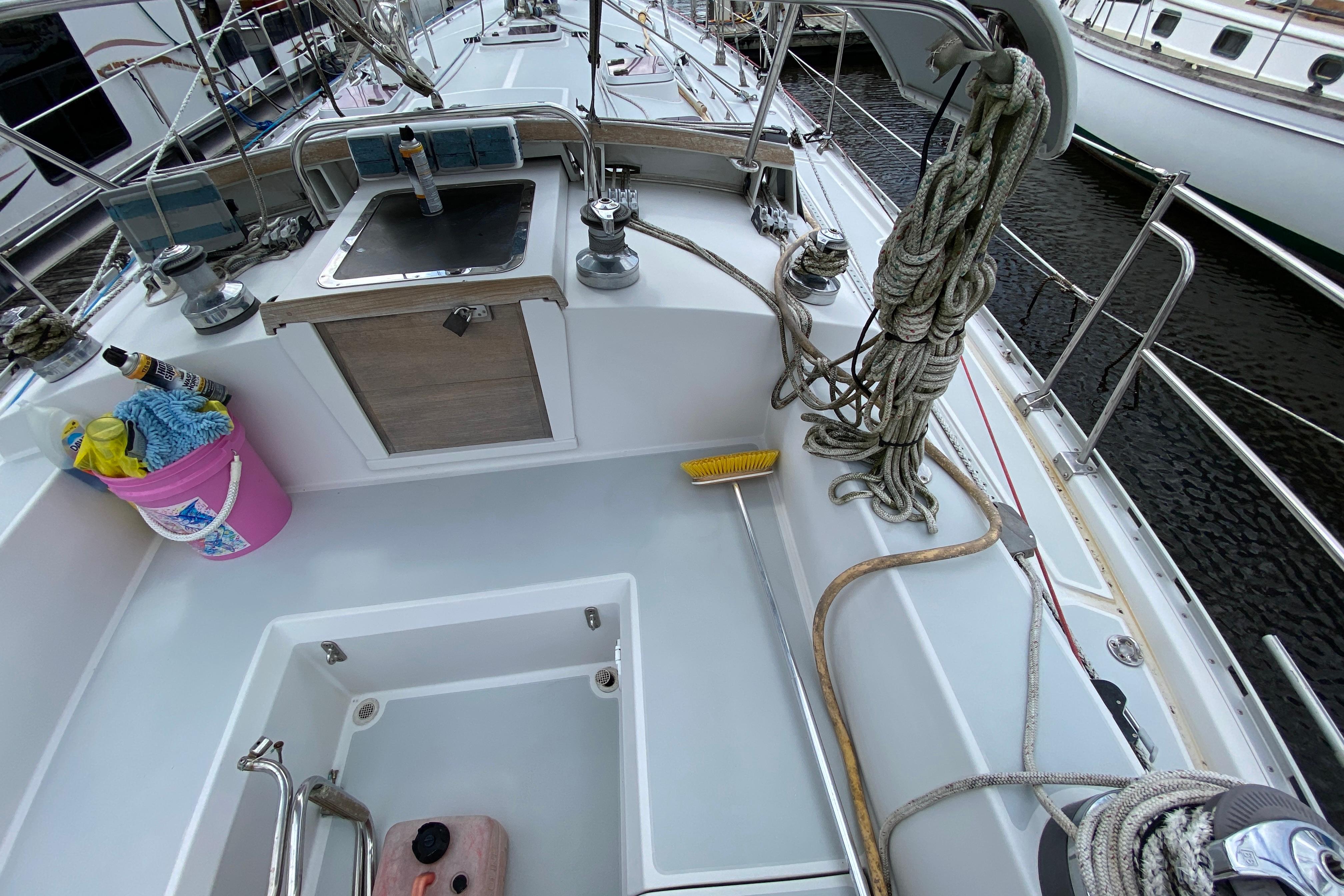 2007 Valiant 50 sailboat deck with ropes, sink, and cleaning supplies.