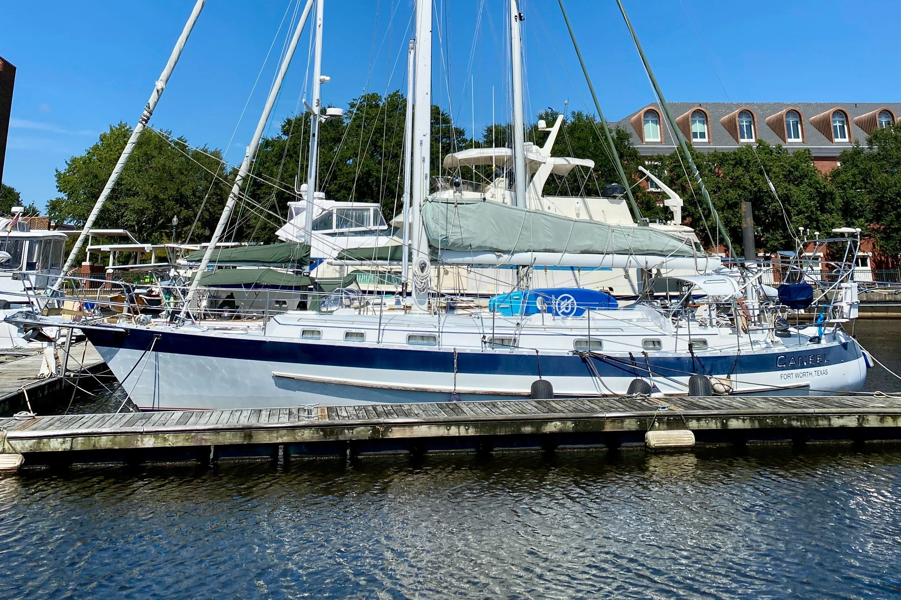 2007 Valiant 50 sailboat docked at marina, clear blue sky background.