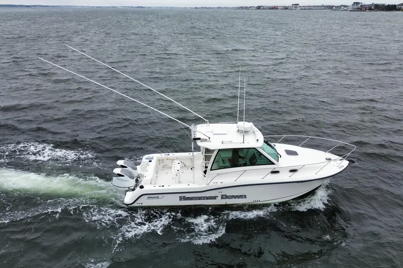 Hammer Down Yacht Photos Pics 2016 Boston Whaler 315 Conquest boat cruising on open water.