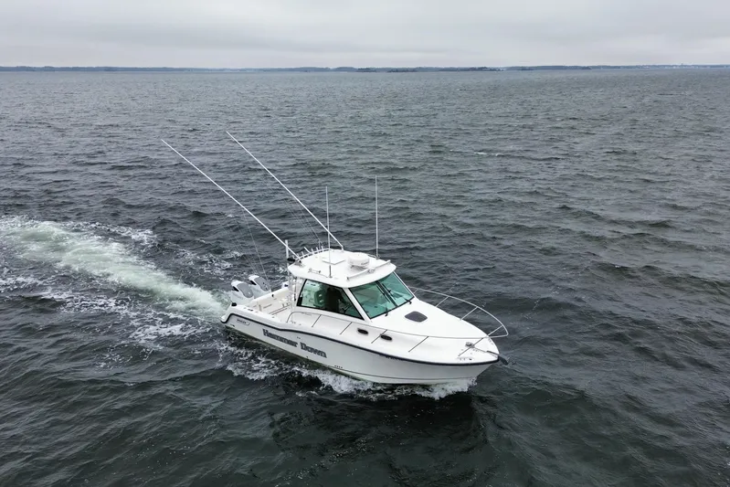 Hammer Down Yacht Photos Pics 2016 Boston Whaler 315 Conquest cruising on open water.
