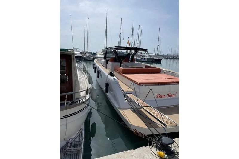 Ban Ban Yacht Photos Pics 2023 Pardo Yachts 50 docked in a marina, featuring sleek design and spacious deck.
