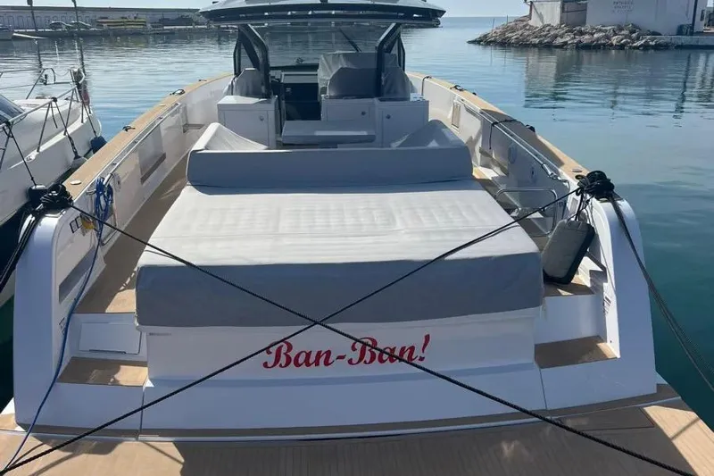 Ban Ban Yacht Photos Pics 2023 Pardo Yachts 50 docked, featuring spacious deck and seating area.