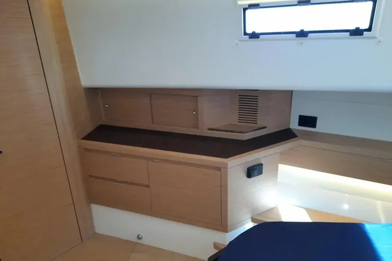 Ban Ban Yacht Photos Pics Interior of 2023 Pardo Yachts 50, featuring sleek wooden cabinetry and modern design elements.