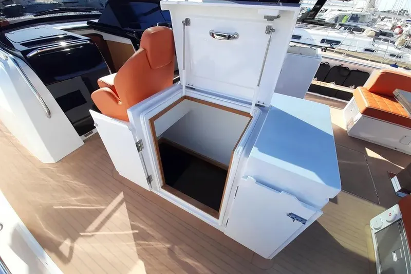 Ban Ban Yacht Photos Pics 2023 Pardo Yachts 50 interior with open storage compartment and orange seating.
