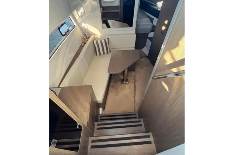  Yacht Photos Pics Interior of 2022 Beneteau Gran Turismo 36, featuring modern seating and wooden finishes.