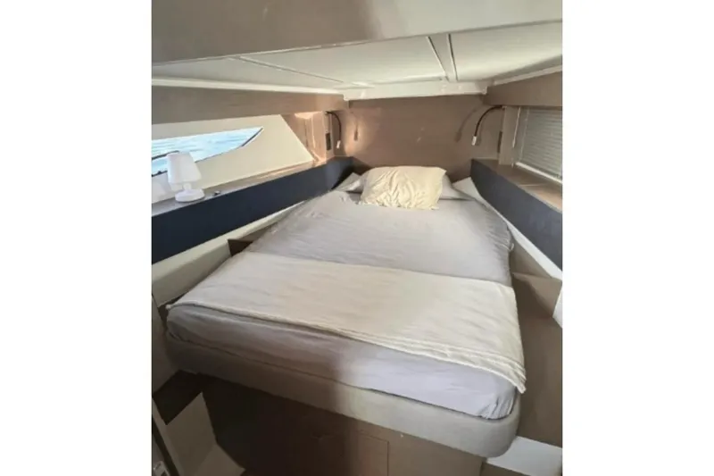  Yacht Photos Pics Interior cabin of 2022 Beneteau Gran Turismo 36 with cozy bed and modern design.