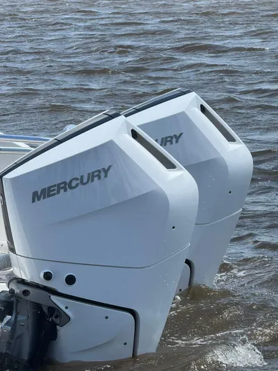 Nauti Time Yacht Photos Pics Twin Mercury outboard engines on a 2024 World Cat 325 CC boat in water.