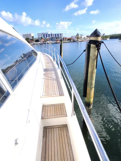  Yacht Photos Pics 2014 Azimut Flybridge yacht docked at marina with clear skies.