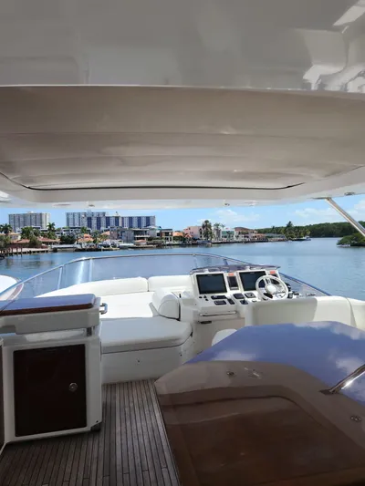  Yacht Photos Pics 2014 Azimut Flybridge yacht interior with modern controls and waterfront view.