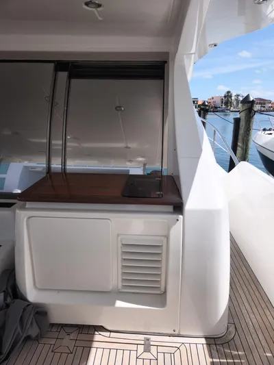  Yacht Photos Pics 2014 Azimut Flybridge yacht deck with sleek design and waterfront view.