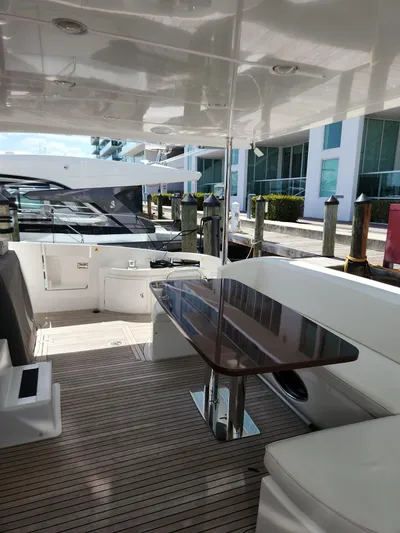 Yacht Photos Pics 2014 Azimut Flybridge yacht interior with sleek seating and polished table.