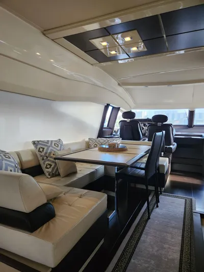  Yacht Photos Pics Luxurious interior of a 2014 Azimut Flybridge yacht with elegant seating and dining area.
