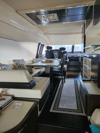  Yacht Photos Pics Luxurious interior of a 2014 Azimut Flybridge yacht with elegant seating and dining area.