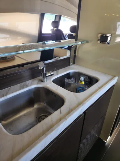  Yacht Photos Pics 2014 Azimut Flybridge yacht kitchen sink with modern fixtures and storage.