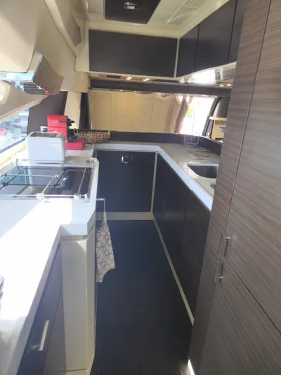  Yacht Photos Pics 2014 Azimut Flybridge yacht kitchen with modern cabinetry and appliances.
