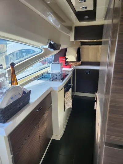  Yacht Photos Pics 2014 Azimut Flybridge yacht kitchen with modern appliances and sleek design.