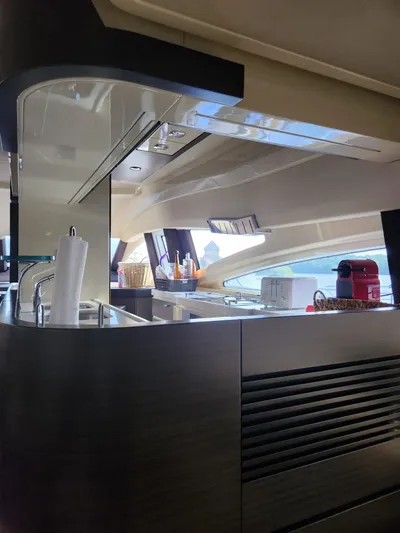  Yacht Photos Pics Interior of a 2014 Azimut Flybridge yacht, featuring a modern kitchen area.