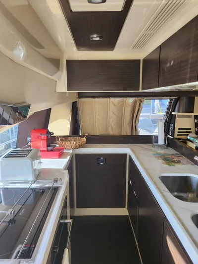  Yacht Photos Pics Interior of 2014 Azimut Flybridge yacht kitchen with modern appliances and sleek design.