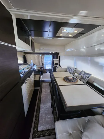  Yacht Photos Pics Luxurious interior of a 2014 Azimut Flybridge yacht with modern dining area.
