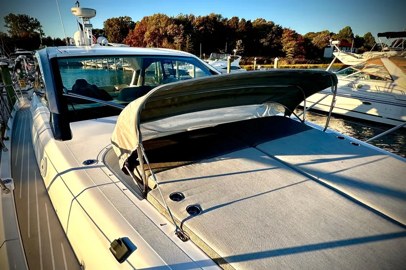 Bellisima Yacht Photos Pics 2019 Azimut Atlantis 51 yacht docked, featuring sleek design and sunshade.