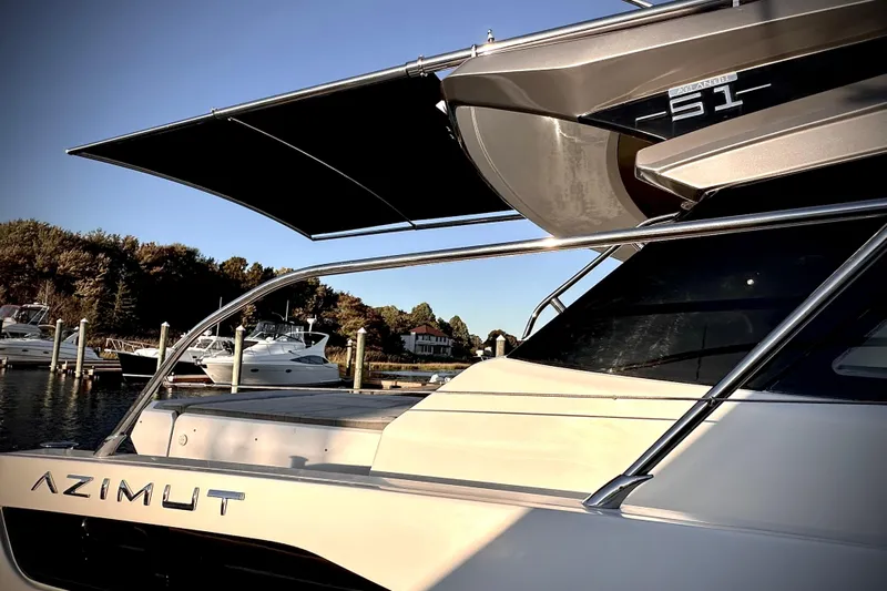 Bellisima Yacht Photos Pics 2019 Azimut Atlantis 51 yacht docked at marina, showcasing sleek design and luxury features.