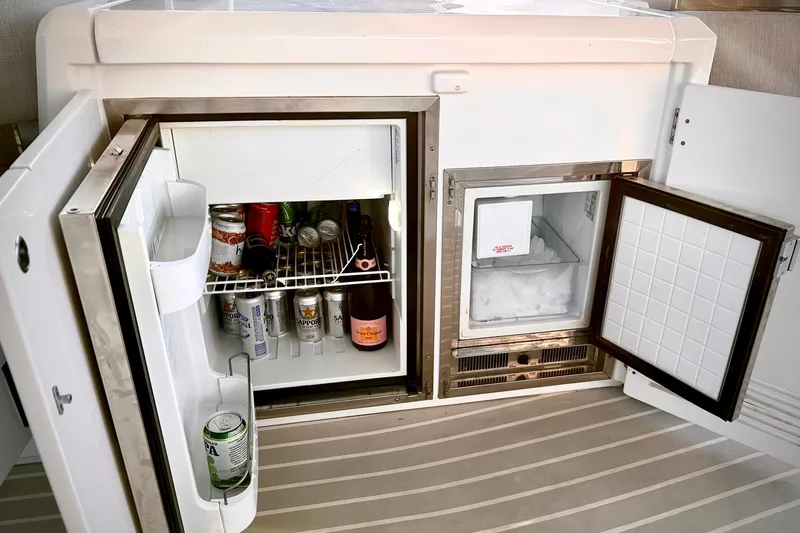 Bellisima Yacht Photos Pics Refrigerator and ice maker on 2019 Azimut Atlantis 51 yacht, stocked with beverages.