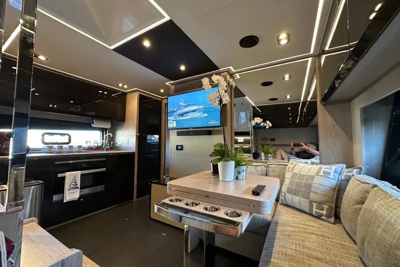 Bellisima Yacht Photos Pics Luxurious interior of 2019 Azimut Atlantis 51 yacht with modern kitchen and cozy seating area.