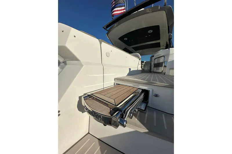 Bellisima Yacht Photos Pics 2019 Azimut Atlantis 51 yacht deck with American flag, showcasing luxury design.