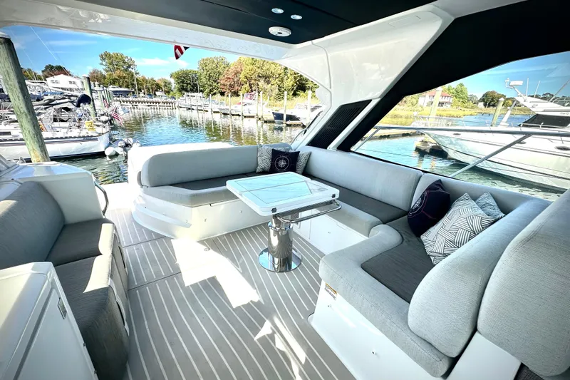 Bellisima Yacht Photos Pics Luxurious 2019 Azimut Atlantis 51 yacht interior with elegant seating and scenic marina view.