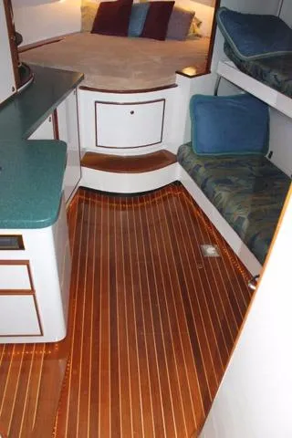 M.a.c. Daddy Yacht Photos Pics 2005 Custom DeSanti Carolina Express cabin with wood flooring and cozy seating.