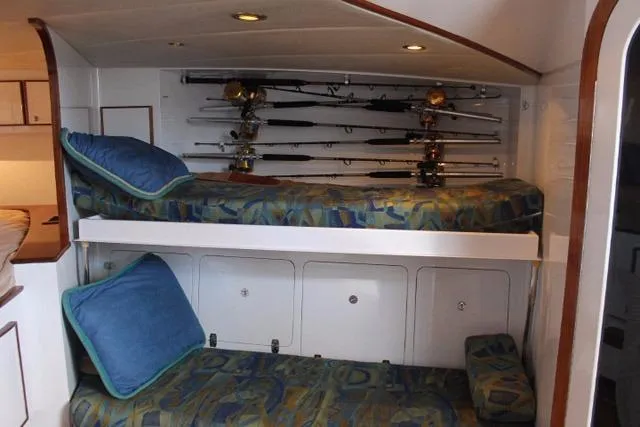 M.a.c. Daddy Yacht Photos Pics Bunk beds with fishing rods in 2005 Custom DeSanti Carolina Express cabin.