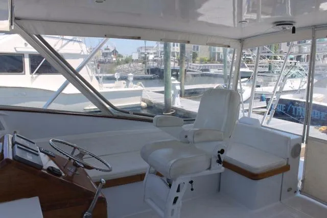 M.a.c. Daddy Yacht Photos Pics Interior of 2005 Custom DeSanti Carolina Express boat with helm and seating area.