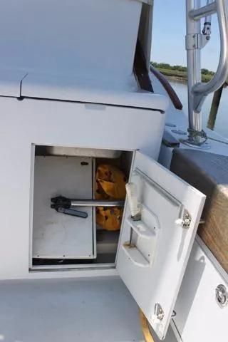 M.a.c. Daddy Yacht Photos Pics Open storage compartment on 2005 Custom DeSanti Carolina Express boat deck.