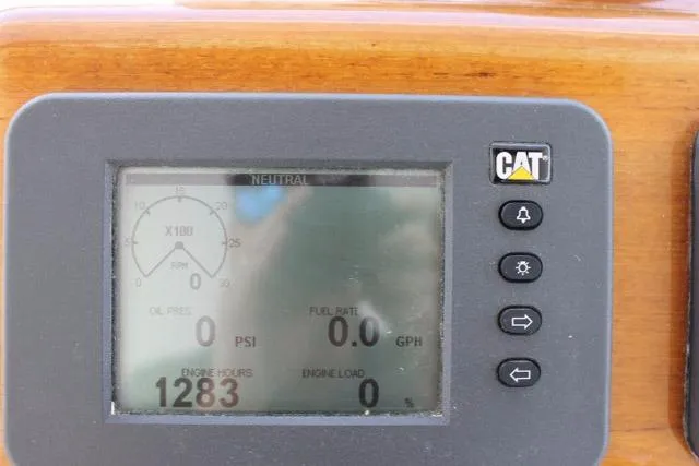 M.a.c. Daddy Yacht Photos Pics Digital display on 2005 DeSanti Carolina Express showing engine metrics and CAT logo.