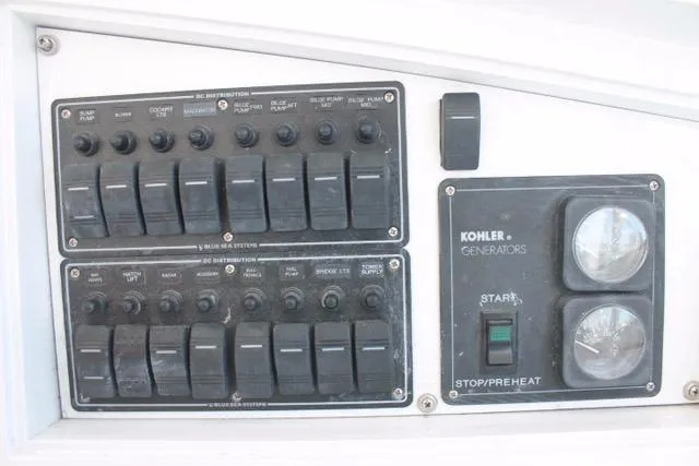 M.a.c. Daddy Yacht Photos Pics Control panel of 2005 Custom DeSanti Carolina Express with Kohler generator switches.