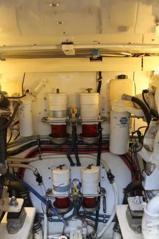 M.a.c. Daddy Yacht Photos Pics Engine room of 2005 Custom DeSanti Carolina Express with visible filters and wiring.