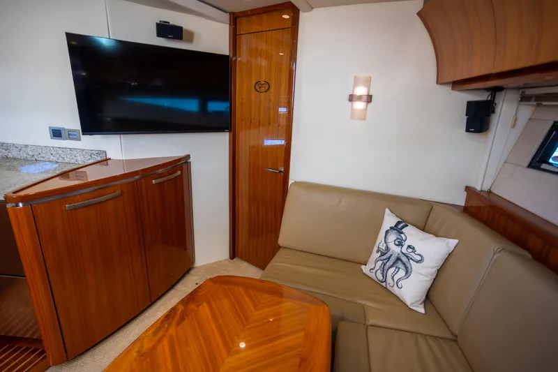  Yacht Photos Pics Luxurious interior of 2018 Cobalt 46 Yacht with elegant wood finishes and modern amenities.