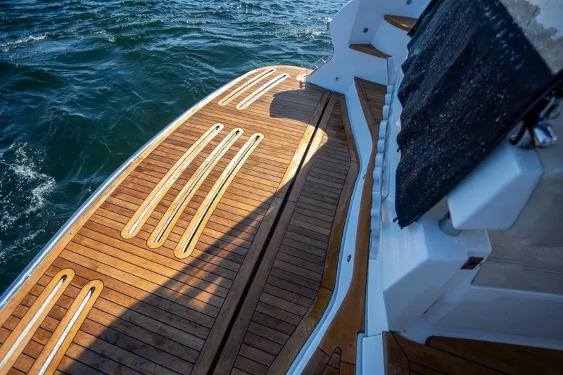  Yacht Photos Pics 2018 Cobalt 46 Yacht with teak deck, cruising on water.