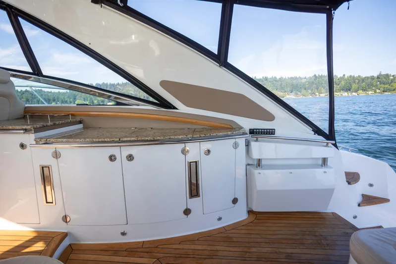 Yacht Photos Pics Luxurious interior of 2018 Cobalt 46 Yacht with elegant wood and granite finishes.