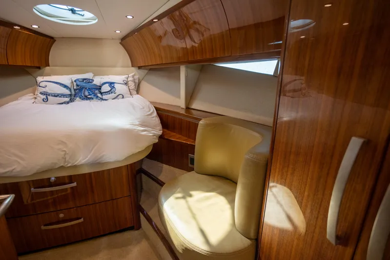  Yacht Photos Pics Luxurious cabin interior of 2018 Cobalt 46 Yacht with elegant wood finish.