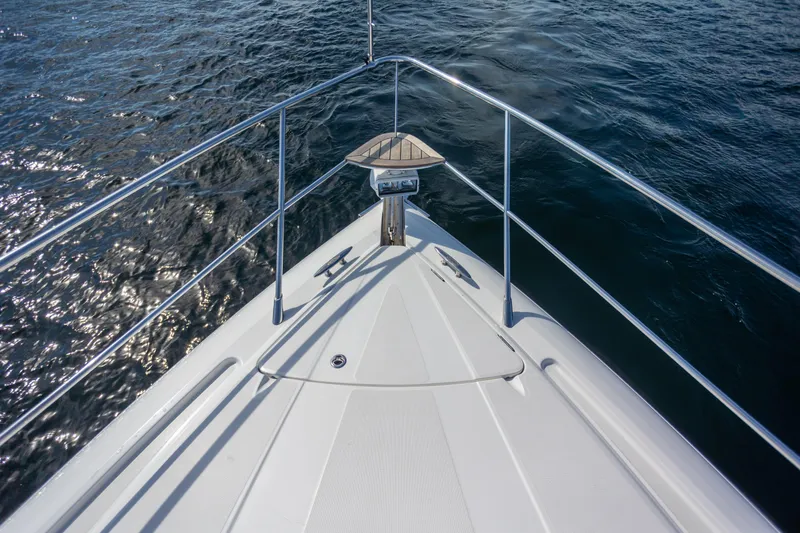  Yacht Photos Pics Bow view of 2018 Cobalt 46 Yacht on open water.