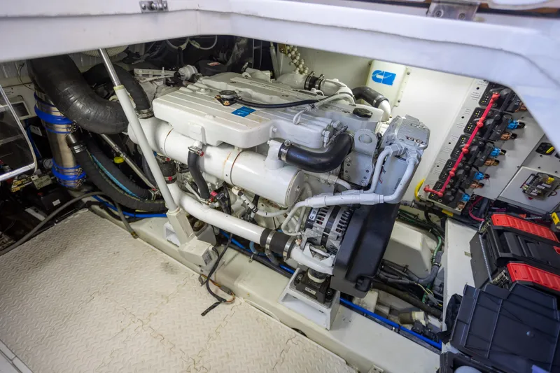  Yacht Photos Pics Engine room of 2018 Cobalt 46 Yacht showcasing mechanical components and wiring.