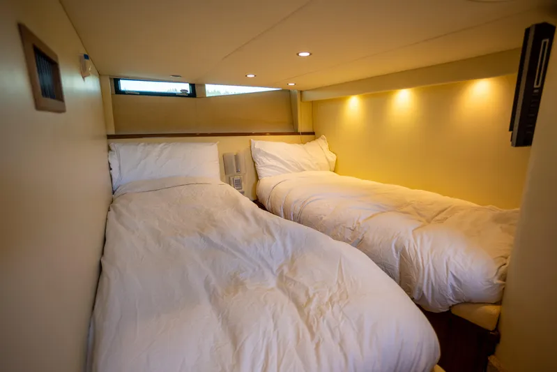  Yacht Photos Pics Interior of 2018 Cobalt 46 Yacht with cozy twin beds and soft lighting.