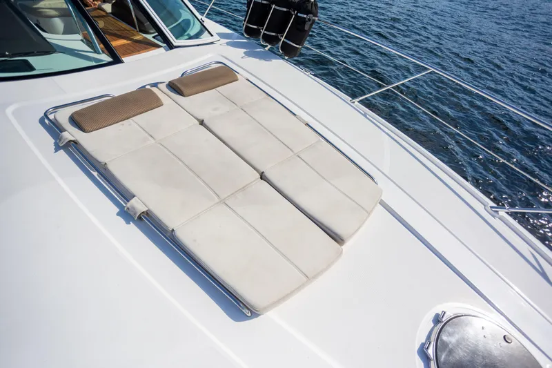  Yacht Photos Pics 2018 Cobalt 46 Yacht sunbathing deck with cushions, overlooking the ocean.
