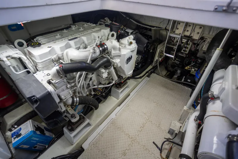  Yacht Photos Pics Engine room of a 2018 Cobalt 46 Yacht, showcasing mechanical components and equipment.